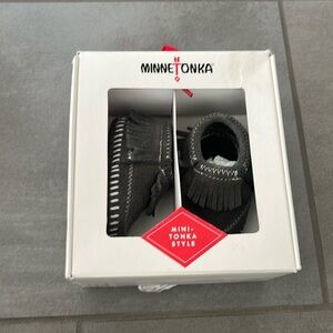 Brand new Minnetonka moccasin size 0 newborn